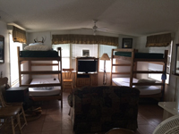 Comfortable bunk beds inside the bunk house cabin at Rancho Rojo Outfitters hunting camp.